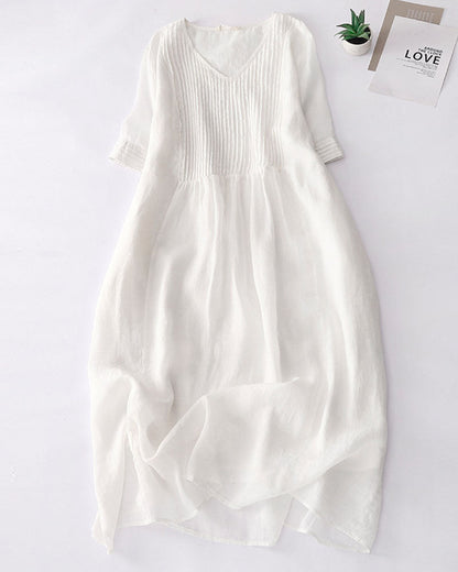 Elegant linen dress with sophisticated pleated details –Clara